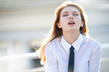 Delightful young woman in ecstasy