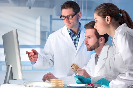 38495348 - group of scientists working at the laboratory